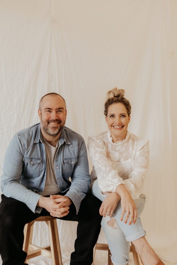 man and woman smiling